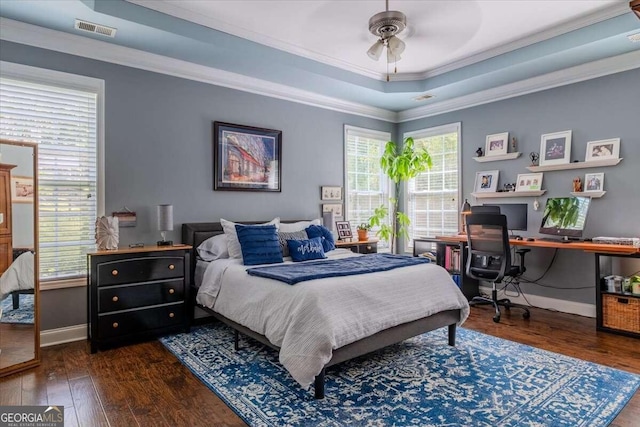 bedroom featuring multiple windows, ceiling fan, dark hardwood / wood-style floors, and ornamental molding