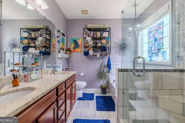 full bathroom featuring vanity, toilet, and independent shower and bath