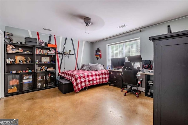 bedroom with concrete floors and ceiling fan