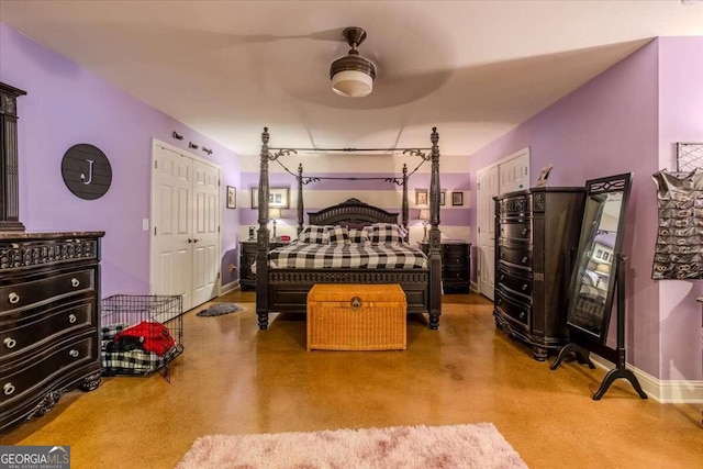 bedroom with concrete floors and ceiling fan