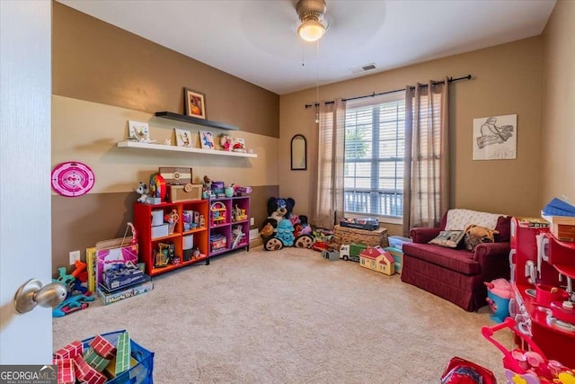 rec room featuring ceiling fan and carpet