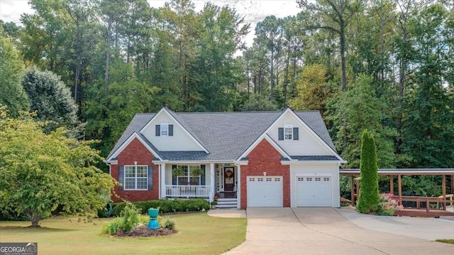 view of front facade with a porch, a garage, and a front lawn