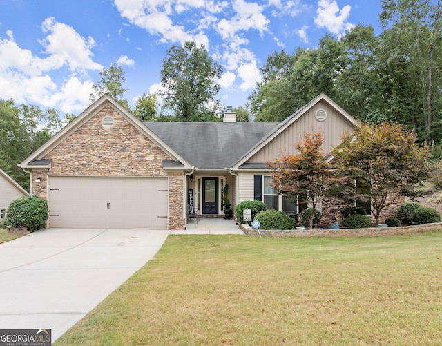 view of front of home with a garage and a front lawn