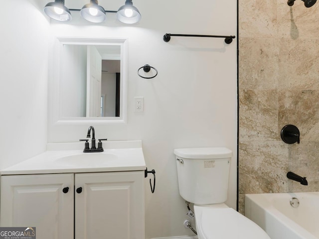 full bathroom with vanity, toilet, and tiled shower / bath