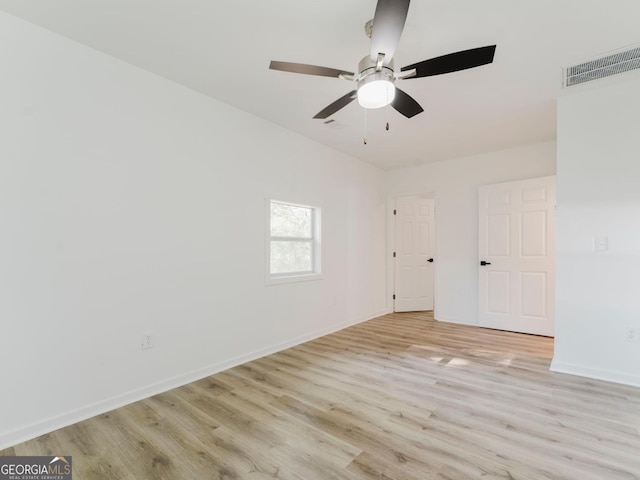 empty room with light hardwood / wood-style floors and ceiling fan