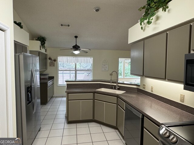 kitchen with stainless steel appliances, sink, gray cabinets, and ceiling fan