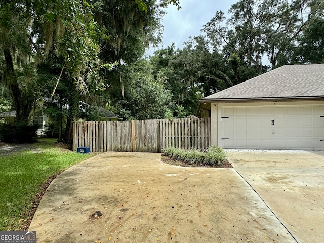 view of yard featuring a garage