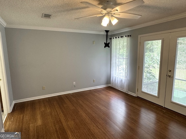 interior space featuring a textured ceiling, plenty of natural light, ceiling fan, and dark hardwood / wood-style floors