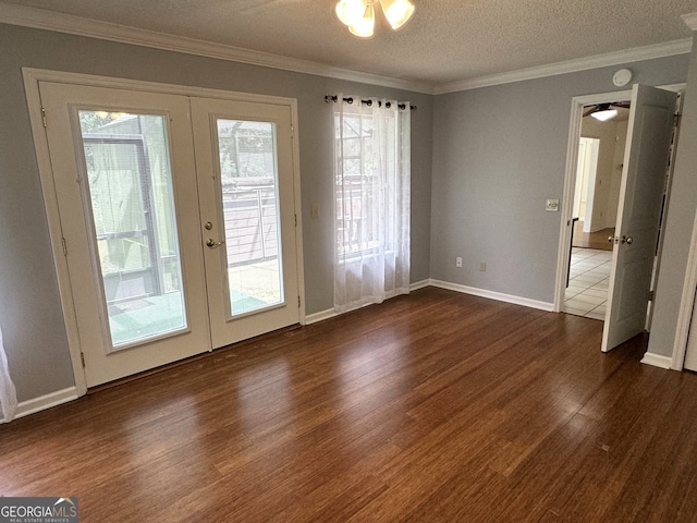 interior space with french doors, a textured ceiling, a wealth of natural light, and dark wood-type flooring