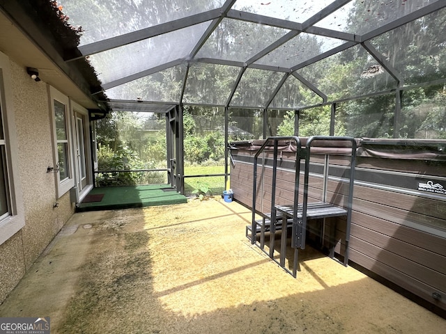 view of patio / terrace featuring a lanai