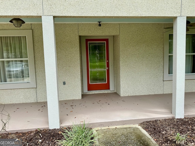 property entrance with a patio area