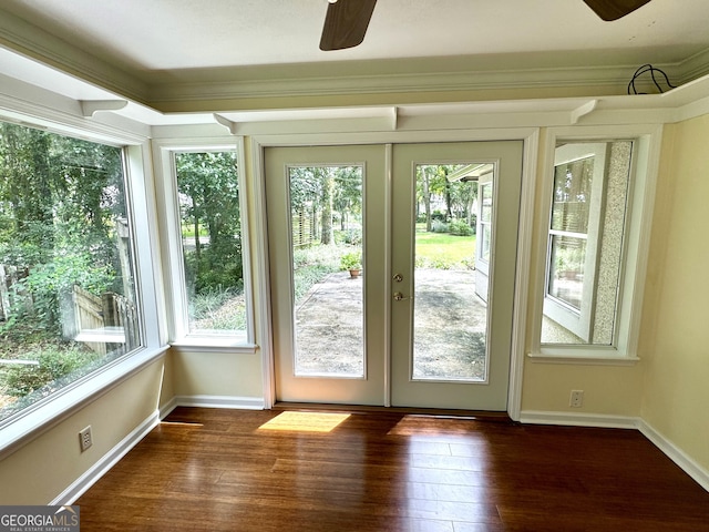 entryway with crown molding, french doors, ceiling fan, and dark hardwood / wood-style flooring