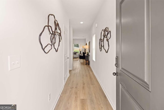 hall with light wood-type flooring