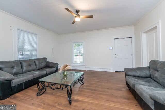 living room with ceiling fan, hardwood / wood-style flooring, and crown molding