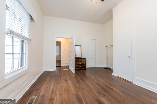 unfurnished bedroom featuring dark hardwood / wood-style flooring