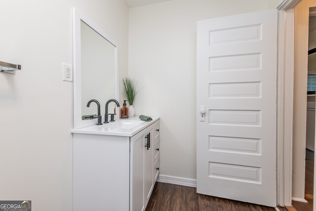 bathroom featuring vanity and hardwood / wood-style flooring