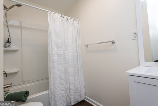 full bathroom featuring vanity, toilet, and shower / bath combo with shower curtain