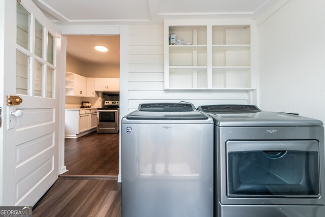 laundry room featuring separate washer and dryer and dark hardwood / wood-style floors