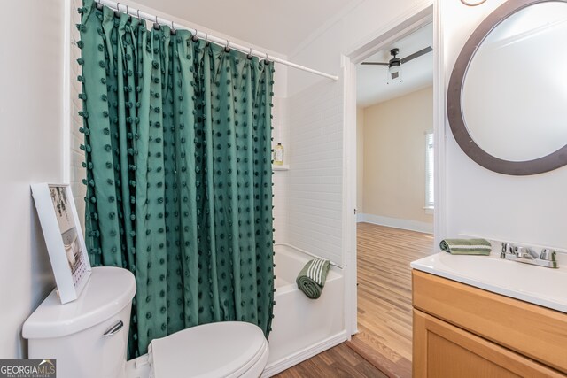 full bathroom with vanity, toilet, hardwood / wood-style flooring, and shower / bath combo