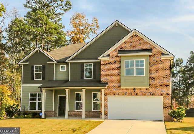 view of front of house with a garage and a front lawn