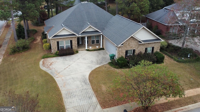 view of front of house with a garage and a front yard