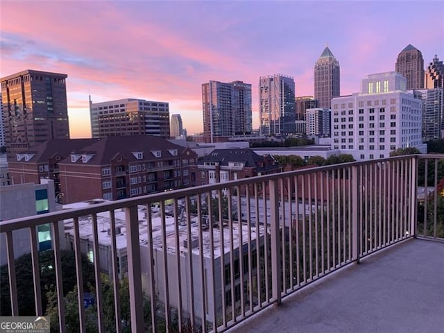 view of balcony at dusk