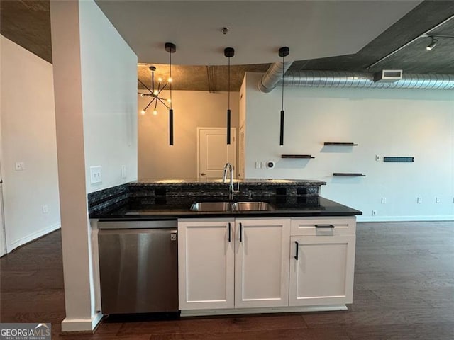 kitchen featuring dishwasher, pendant lighting, sink, and dark hardwood / wood-style flooring