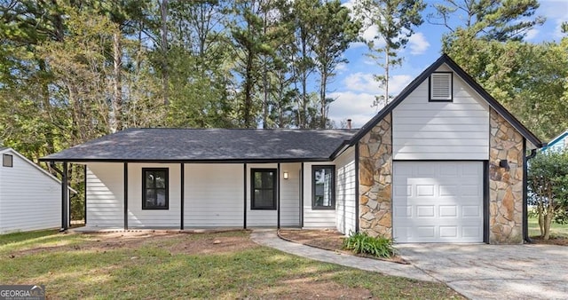 single story home featuring a porch and a garage