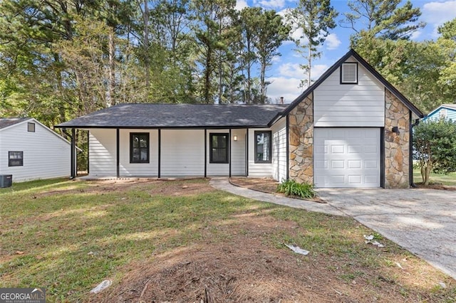 ranch-style home with a garage, a porch, a front yard, and central AC unit