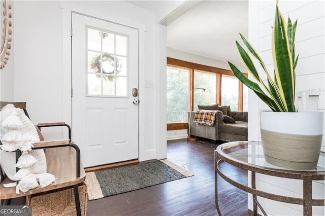 entryway with wood finished floors