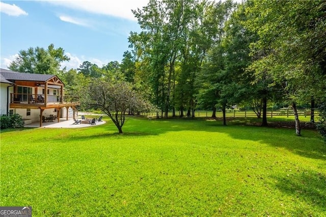 view of yard with fence and a patio area