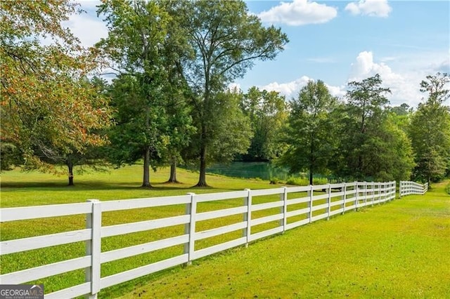 exterior space featuring fence and a yard