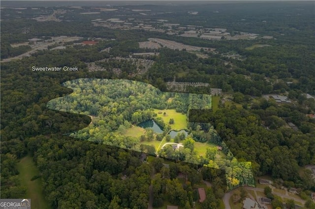 bird's eye view featuring a forest view