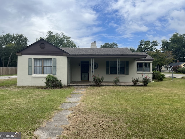 view of front facade with a front yard and a porch