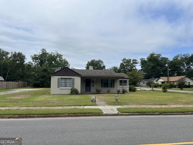 view of front of home with a front lawn