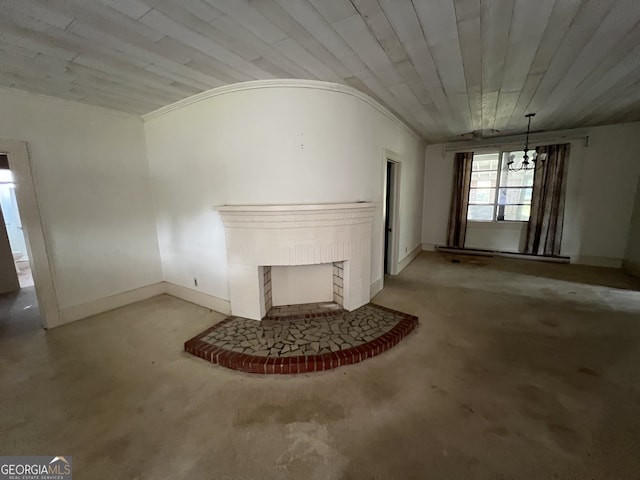 unfurnished living room featuring lofted ceiling, a notable chandelier, and a fireplace