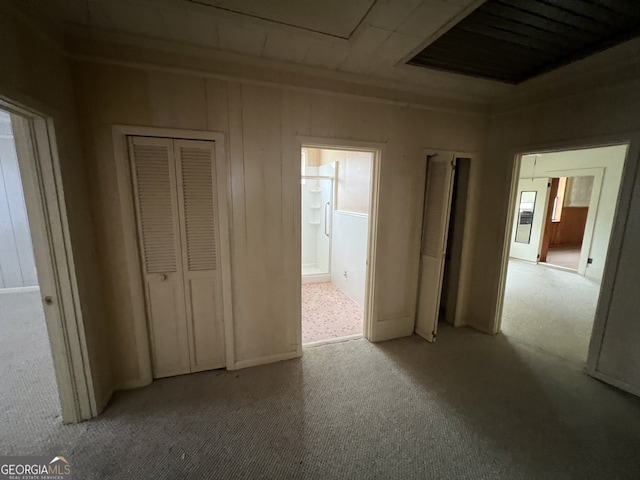 unfurnished bedroom with multiple windows and light colored carpet