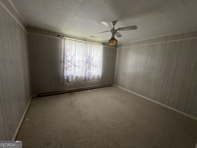 unfurnished room featuring ceiling fan and carpet