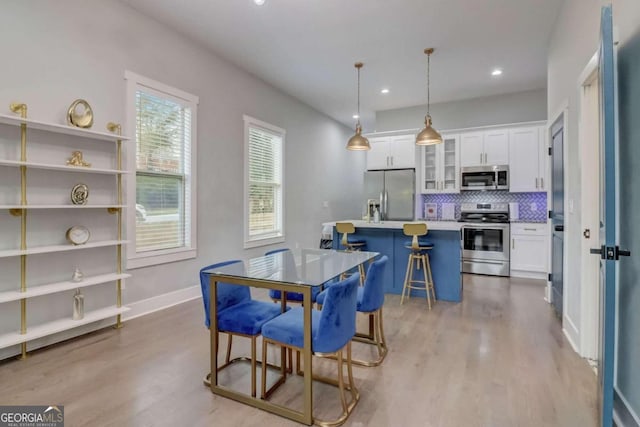 dining room featuring light hardwood / wood-style floors