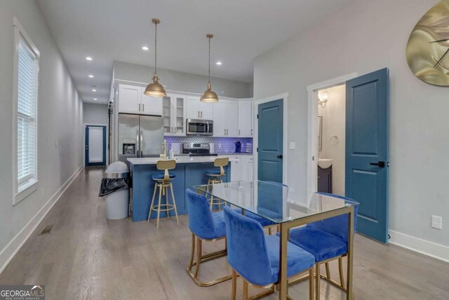 dining room featuring light hardwood / wood-style floors