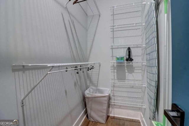 walk in closet featuring hardwood / wood-style floors