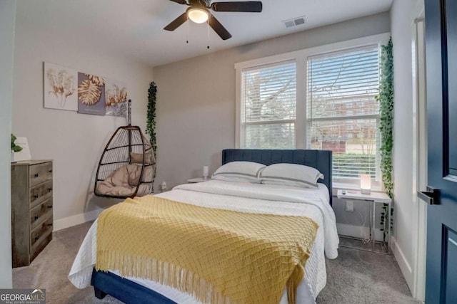 carpeted bedroom featuring ceiling fan