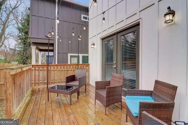 wooden deck featuring outdoor lounge area