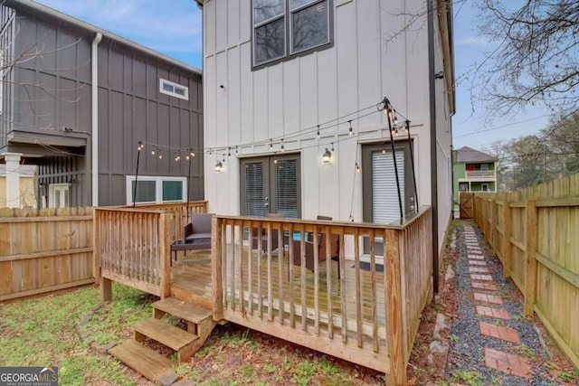 rear view of house with a wooden deck