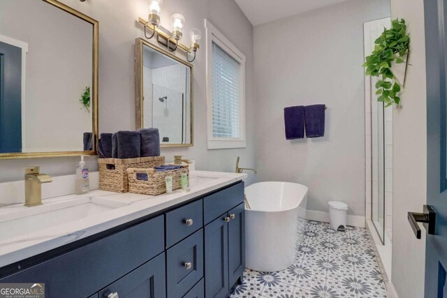 bathroom with vanity and independent shower and bath