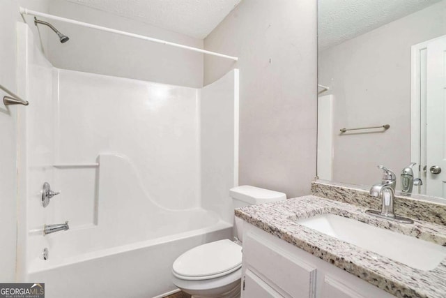 full bathroom featuring shower / bathtub combination, toilet, a textured ceiling, and vanity