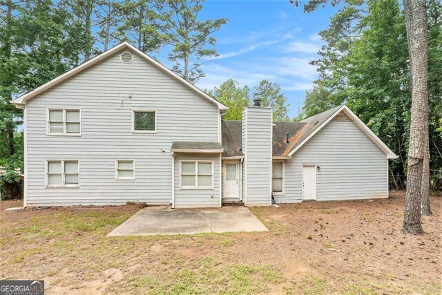 back of property featuring a patio