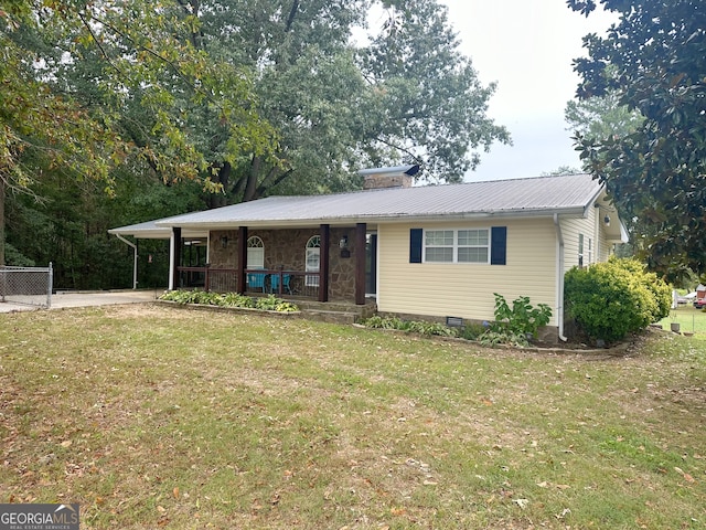 single story home with covered porch and a front yard