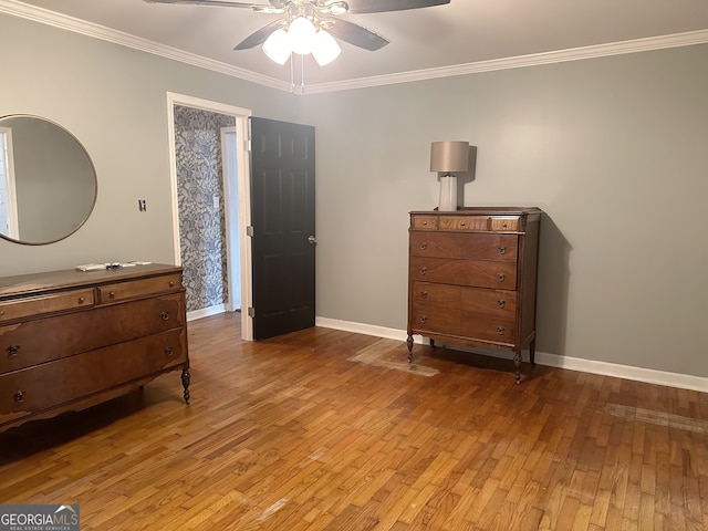 bedroom with ceiling fan, light hardwood / wood-style floors, and ornamental molding