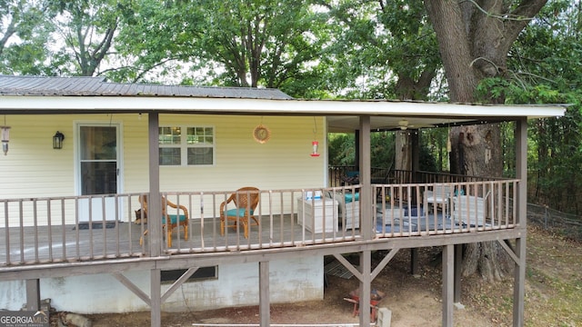 rear view of house with a wooden deck